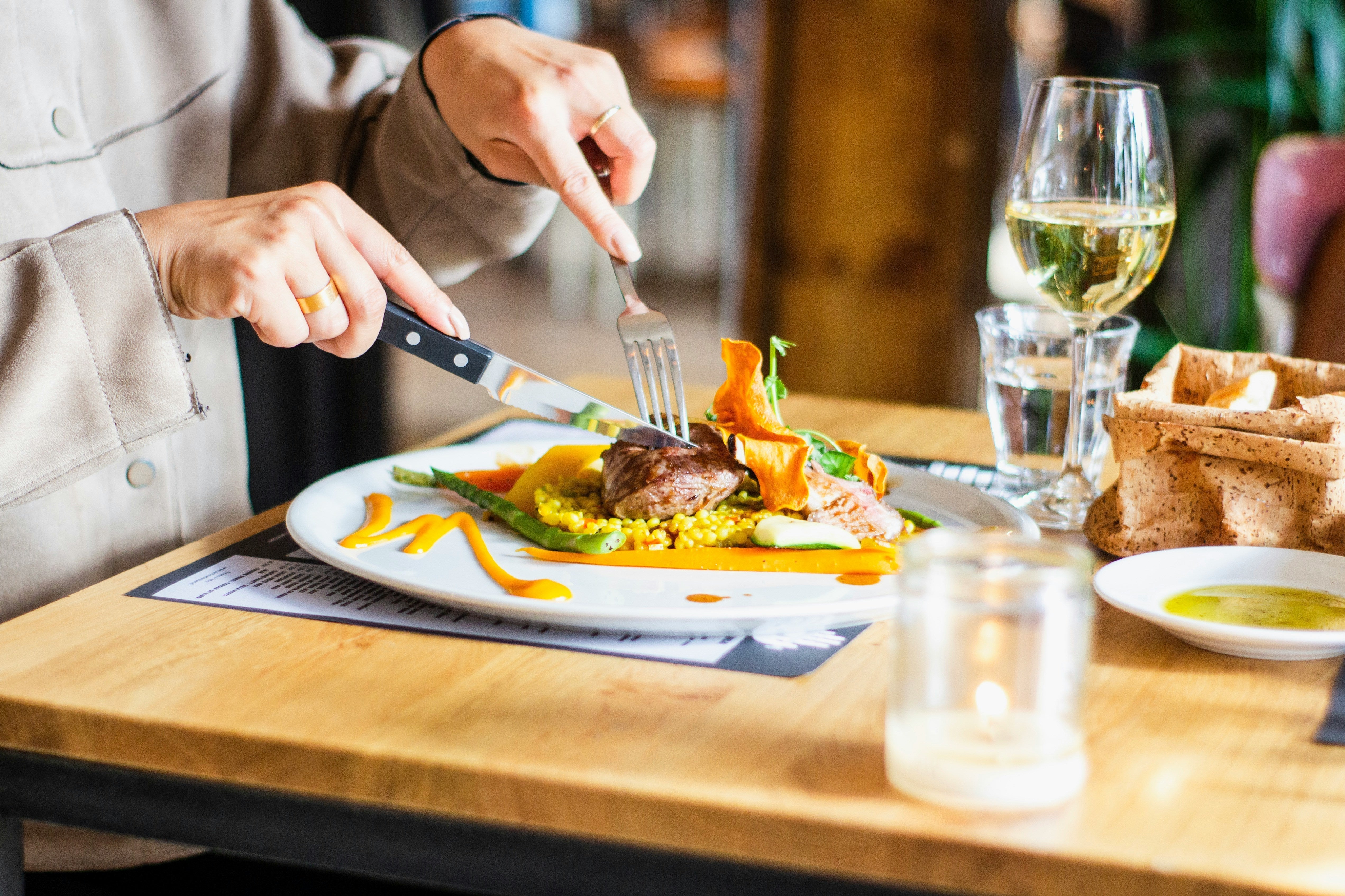 How can I identify genuine EVOO when shopping or dining out?