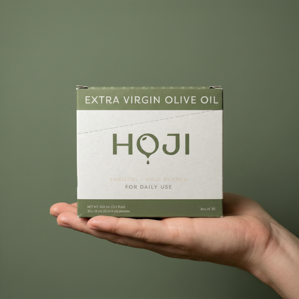 A hand holds a green and white box labeled My Store 30 PACK (LEGACY) against a matching green background. The travel-sized pack features simple, modern design, making it perfect for everyday use.