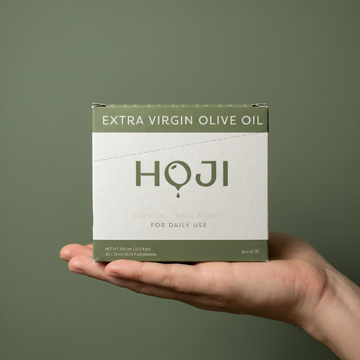 A hand holds a green and white box labeled My Store 30 PACK (LEGACY) against a matching green background. The travel-sized pack features simple, modern design, making it perfect for everyday use.