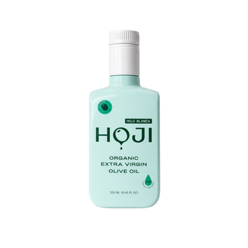 The HOJI BLANCA BOTTLE by Hoji is a light turquoise 250 mL bottle with a white cap, green accents, and minimal design, labeled as organic extra virgin hojiblanca olive oil.