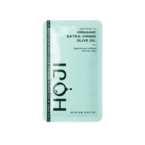 The HOJI BLANCA 30 PACK by Hoji features single-serve Hojiblanca extra virgin olive oil sachets in a light green packet, promoting wellbeing, with each sachet containing 10 ml (0.34 fl oz).