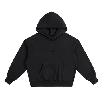 The HOJI HOODIE by Hoji is a heavyweight black hoodie with a front pocket, subtle OLIVE OIL text in white on the chest, and a clean drip logo design, shown on a plain white background.