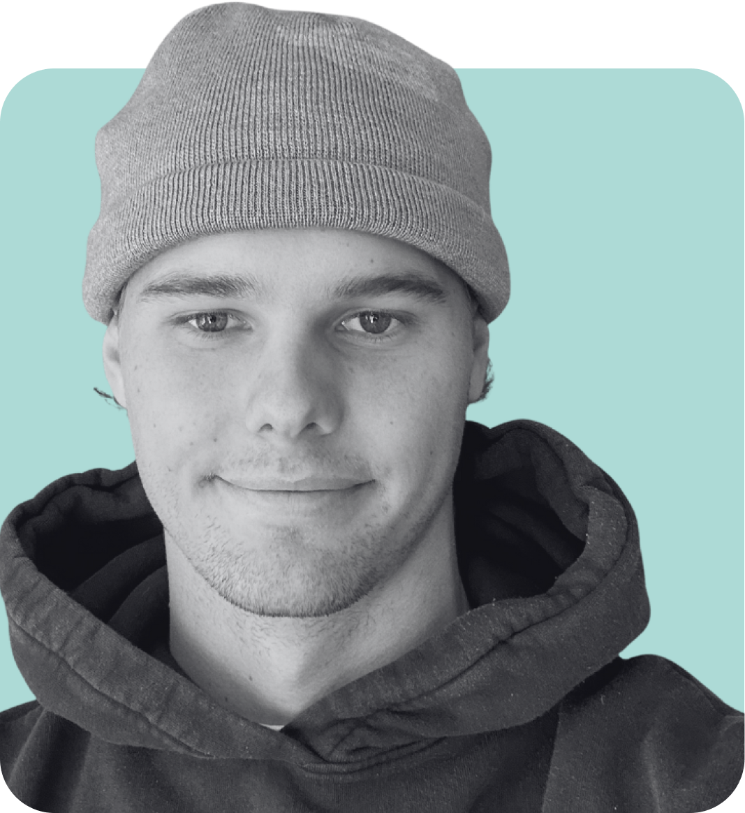 A young person wearing a gray beanie and a dark hoodie, smiling softly, with a light blue background.